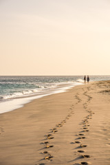Two women walking on the beach in Sal, Cape Verde, Africa