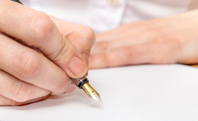 Woman writing using pen