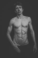 Fototapeta premium Portrait of a Muscular man in a studio