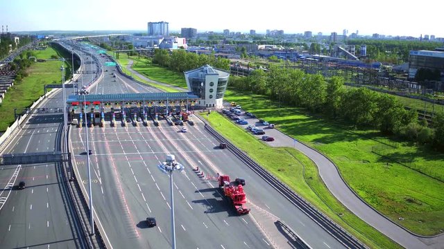 Aerial view of highway with Cars at modern toll road turnpike, entry fee pay gate