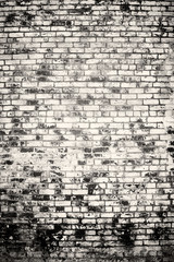 Black and white of old vintage brick wall with vignetted corners