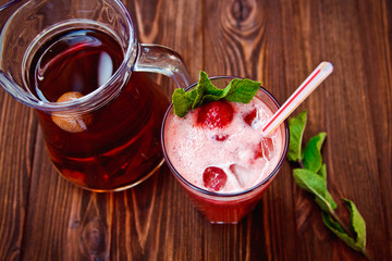 Fresh cold strawberry tea with ice and mint