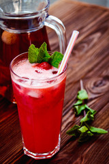 Fresh cold strawberry tea with ice and mint