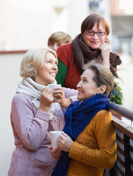 Women having tea on terrace