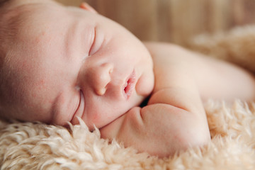 Cute Sleeping Newborn Baby In A Wooden Basket