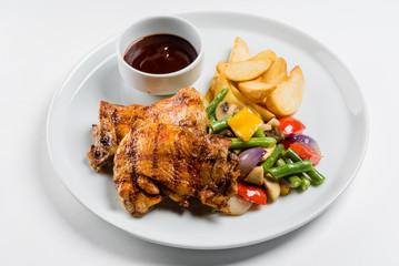 steak with potatoes and vegetables