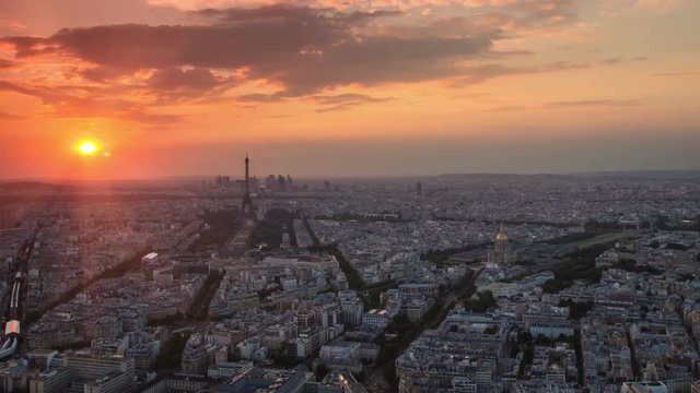 paris city skyline cityscape aerial view time lapse from day to night pan panning starting at the sunset ending with city illuminated