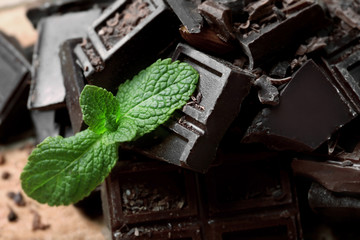 Chocolate pieces with mint leaves, close up