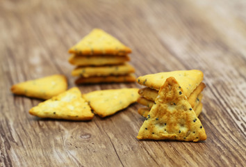 Crunchy salty snacks with sesame seeds and poppy seeds
