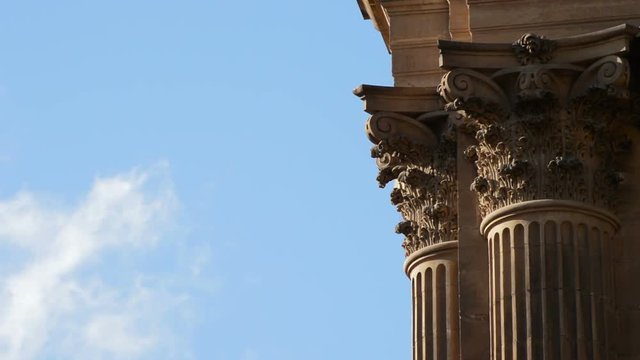 Detail of column capitel of big church or cathedral with clouds passing in timelapse