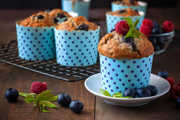 Muffins with blueberries and raspberries, summer, healthy breakfast, selective focus, toned image