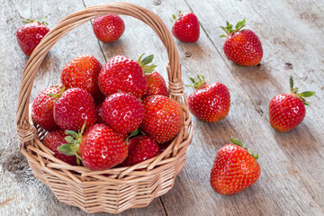 Fresh strawberries in a wicker basket.