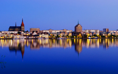 Obraz premium Night Panorama view to Rostock. River Warnow and City port.