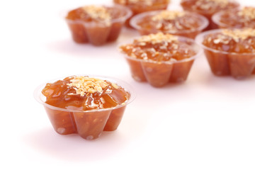 Single of circle brown flavored sweet translucent gelatinous rice.