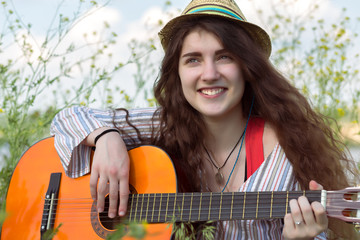 Portrait of inspired female musician outdoors
