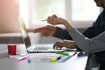 Man and Woman discussing Start Up Project pointing on Computer