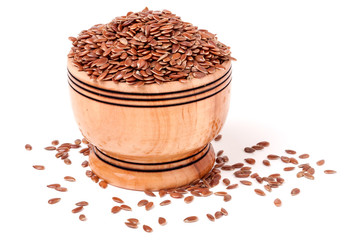 flax in a wooden bowl isolated on white background