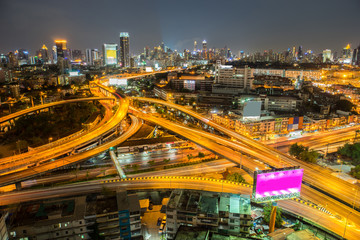 road at night in Bangkok city , Thailand.