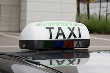sign of taxi on the car
