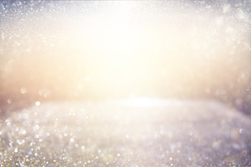 glitter vintage lights background. gold, silver, blue and white