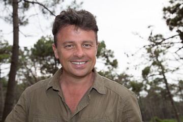 Portrait of a smiling cheerful man smiling at the camera