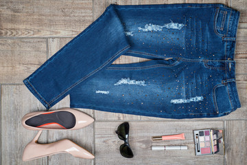 Aerial  view of woman's jeans and accessories