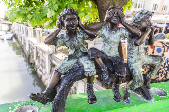 Small bronze kid sculptures as urban decoration in Yalova city downtown, Turkey
