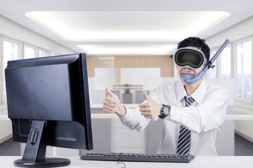 Funny businessman with goggles in office