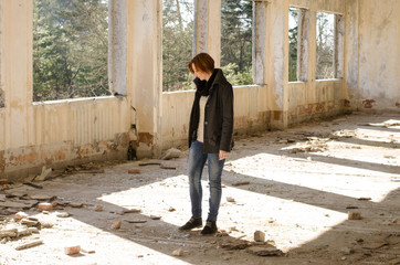 
girl posing in an abandoned building  