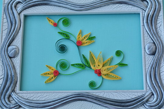 Handmade paper flowers in the frame