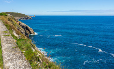 Cliff area in the resort town of Llanes, Spain