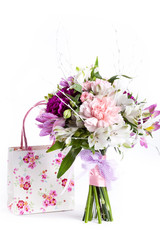 Pastel bouquet from pink and purple gillyflowers on white with g