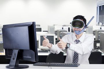 Worker with goggles and snorkel at workplace