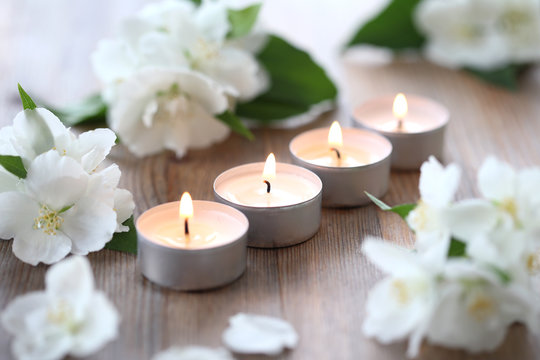 Wellness mockorange and burning candles