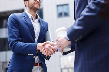 Fototapeta na wymiar Successful two businessmen doing handshake by meeting