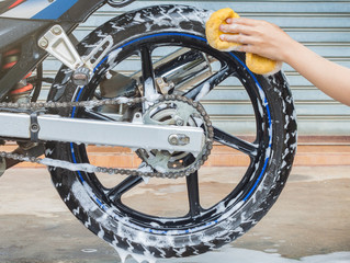 washing a motorcycle wheel