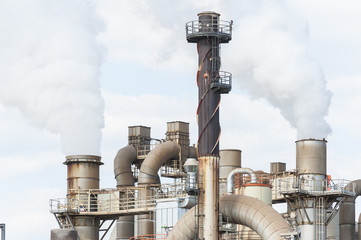 industrial plant of a furniture factory with smoking smokestacks