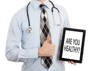 Doctor holding tablet - Are you healthy?