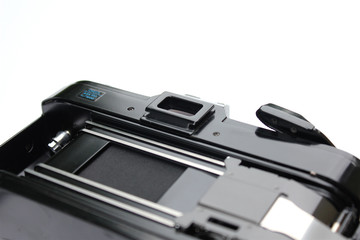 Open old camera in detail without negative film, white background, large space for a text