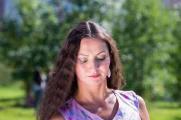 Young woman in summer park