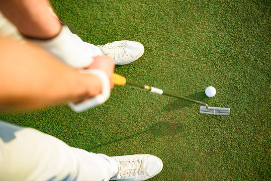 Golf player ready to putting ball