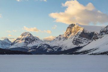 Beautiful snow covered mountain with morning sunlight hitting the peak. Taken at Bow Lake, Icefields Pkwy, Alberta, Canada.