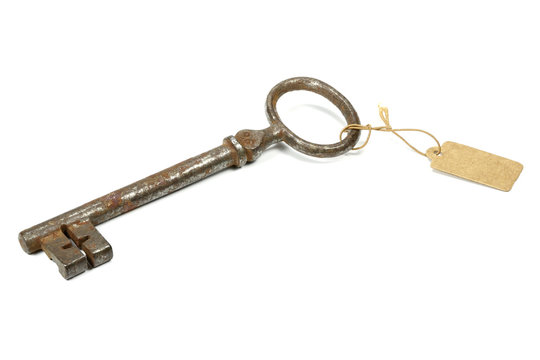 antique key with tag isolated on white background