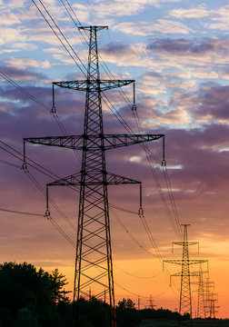 metal Bearing high voltage power line during sunset or sunrise
