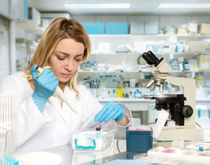 Fototapeta premium Young female tech or scientist works in research facility