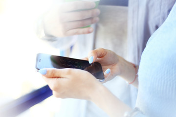 Young woman using a touchscreen smartphone.