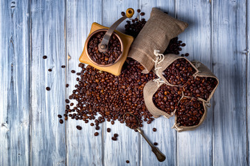 Jute bags with coffee beans and grinder