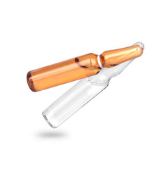falling two ampoules on white background