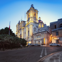Fototapeta na wymiar Illuminated St. Lawrence Church in Vittoriosa, Malta