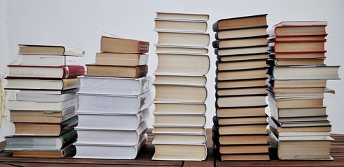 piles of  books on table aoutdoors